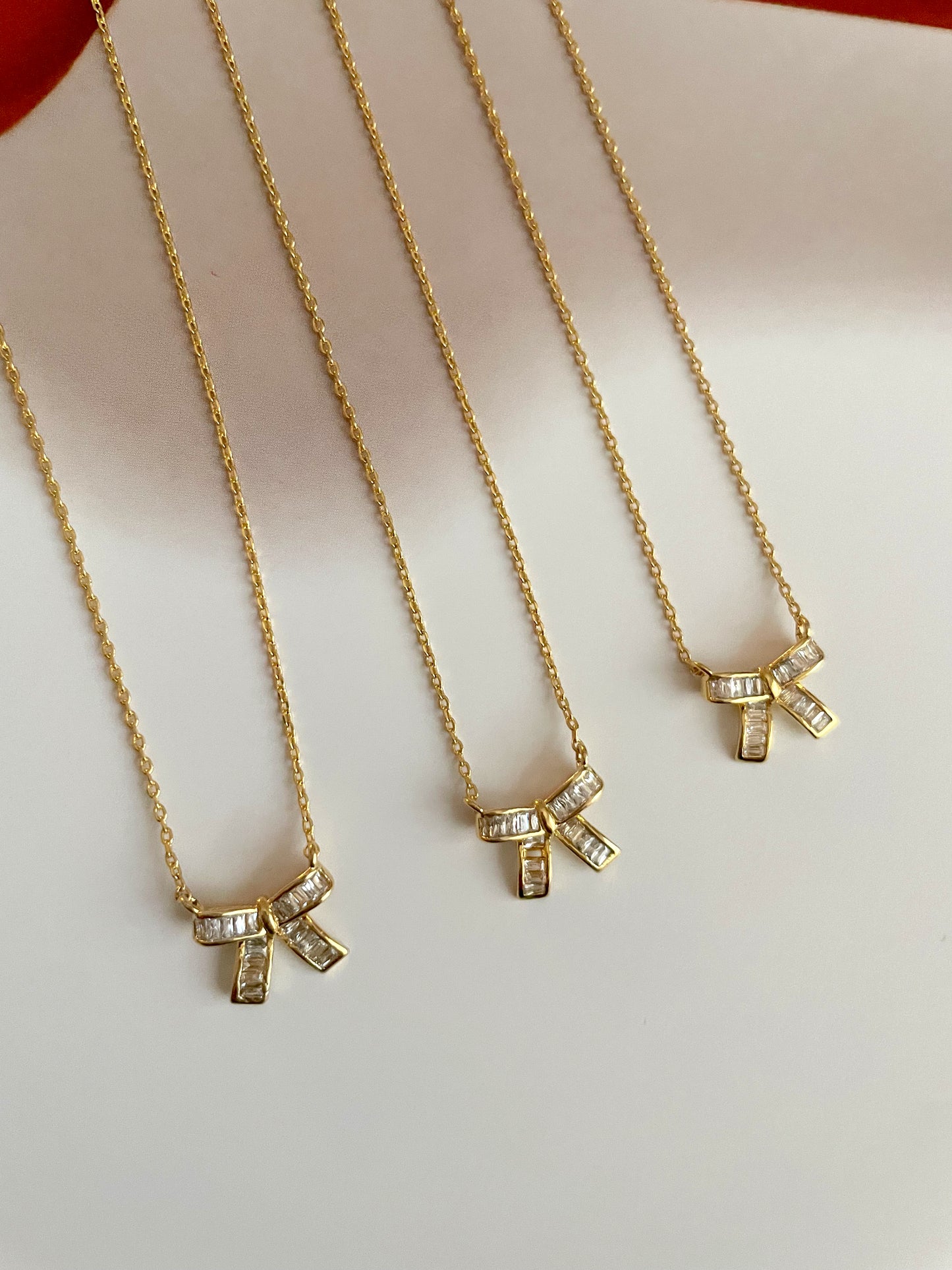 Mini baguette bow necklace