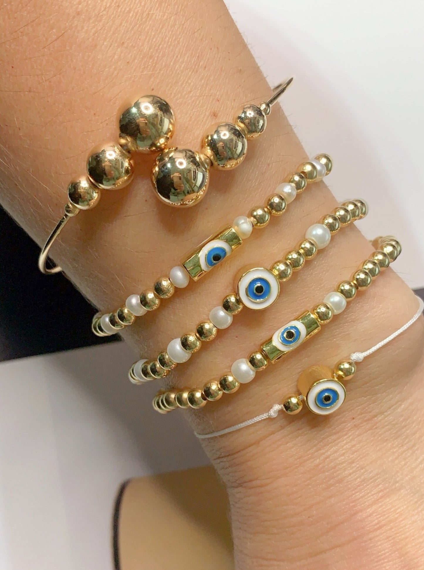 Pearls and Gold Evil Eye Bracelets