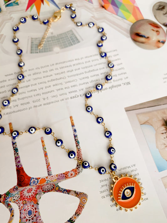 Orange pendant and blue evil eye necklace