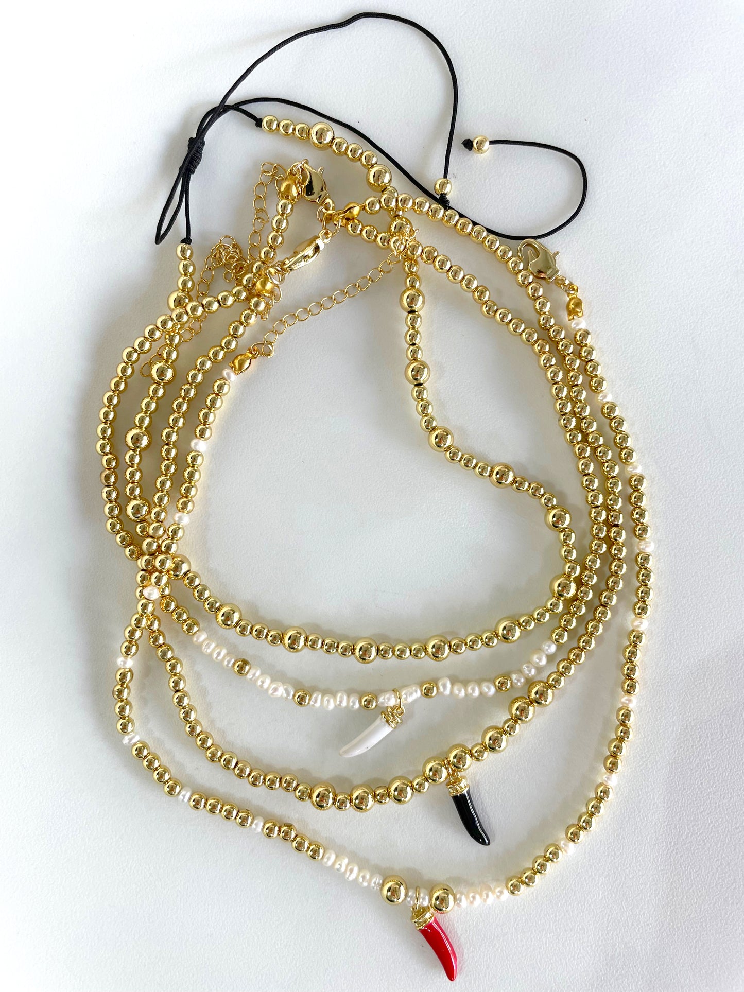 Gold beaded colored tooth necklace